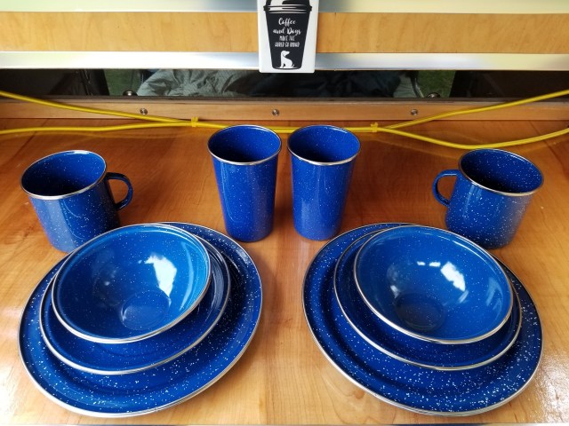 blue enamelware set with dish, bowl, cup and mug for 2 people
