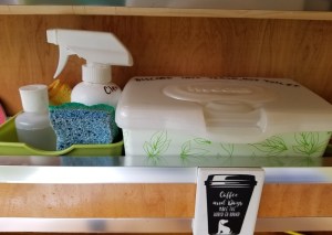 supplies for dishwashing and kitchen cleaning in Teardrop trailer galley