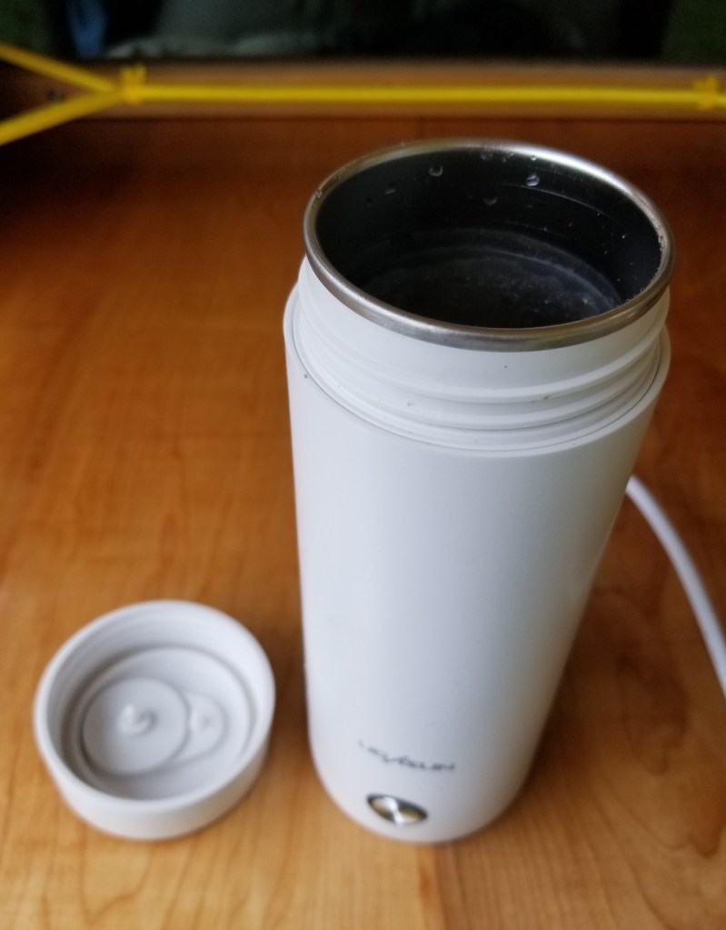 travel mug sized kettle, top removed showed stainless steel inner liner