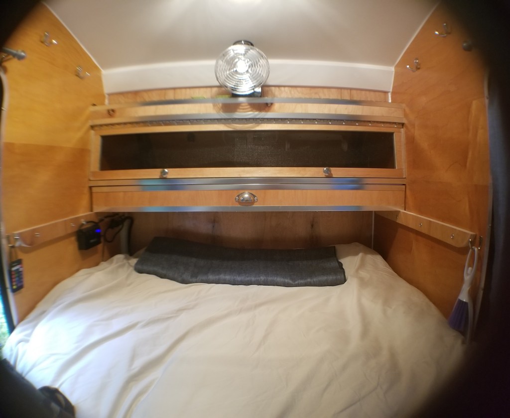 storage areas above foot of bed in teardrop trailer
