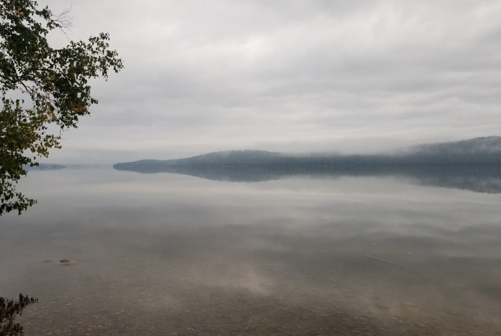 misty morning on calm northern lake