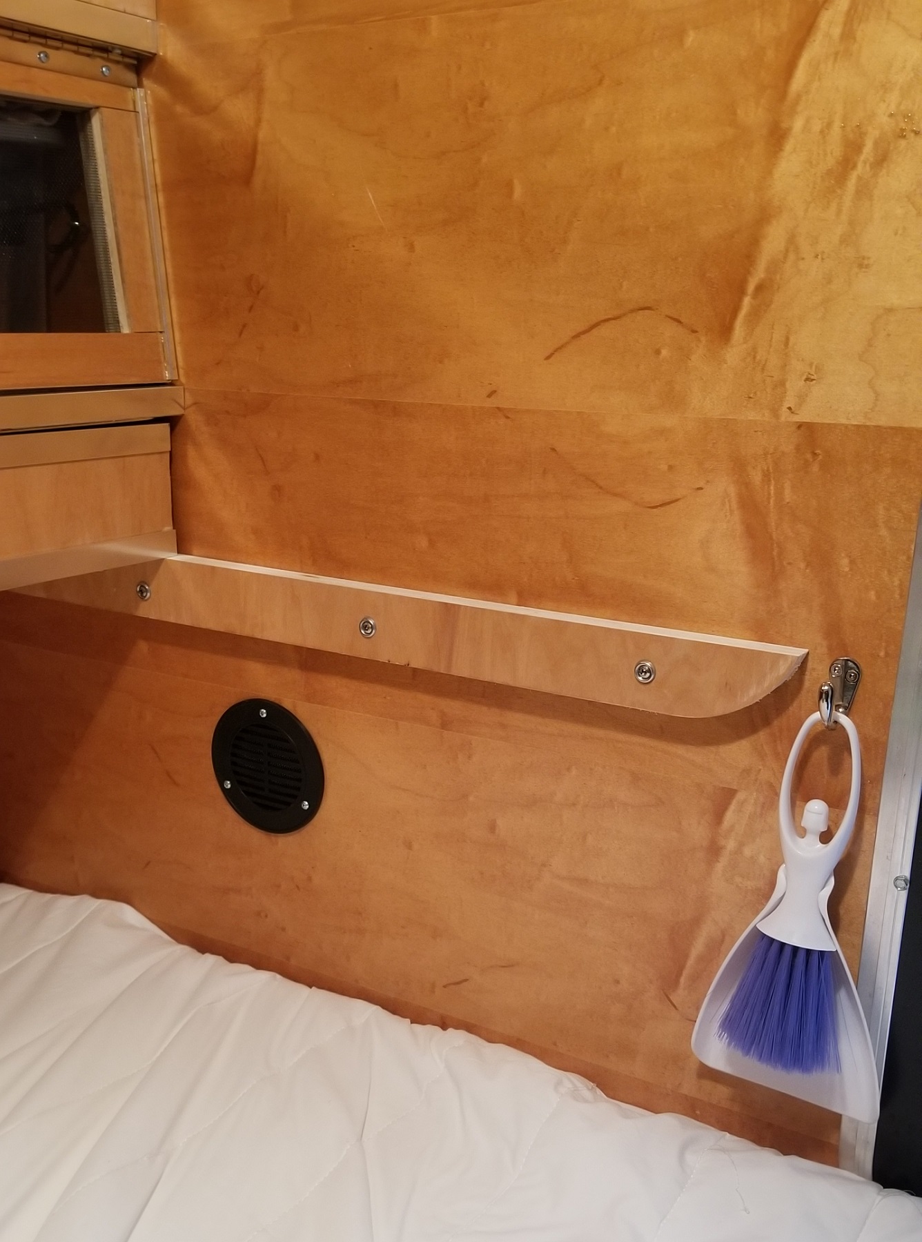 teardrop trailer interior with vent louvre installed low on wall