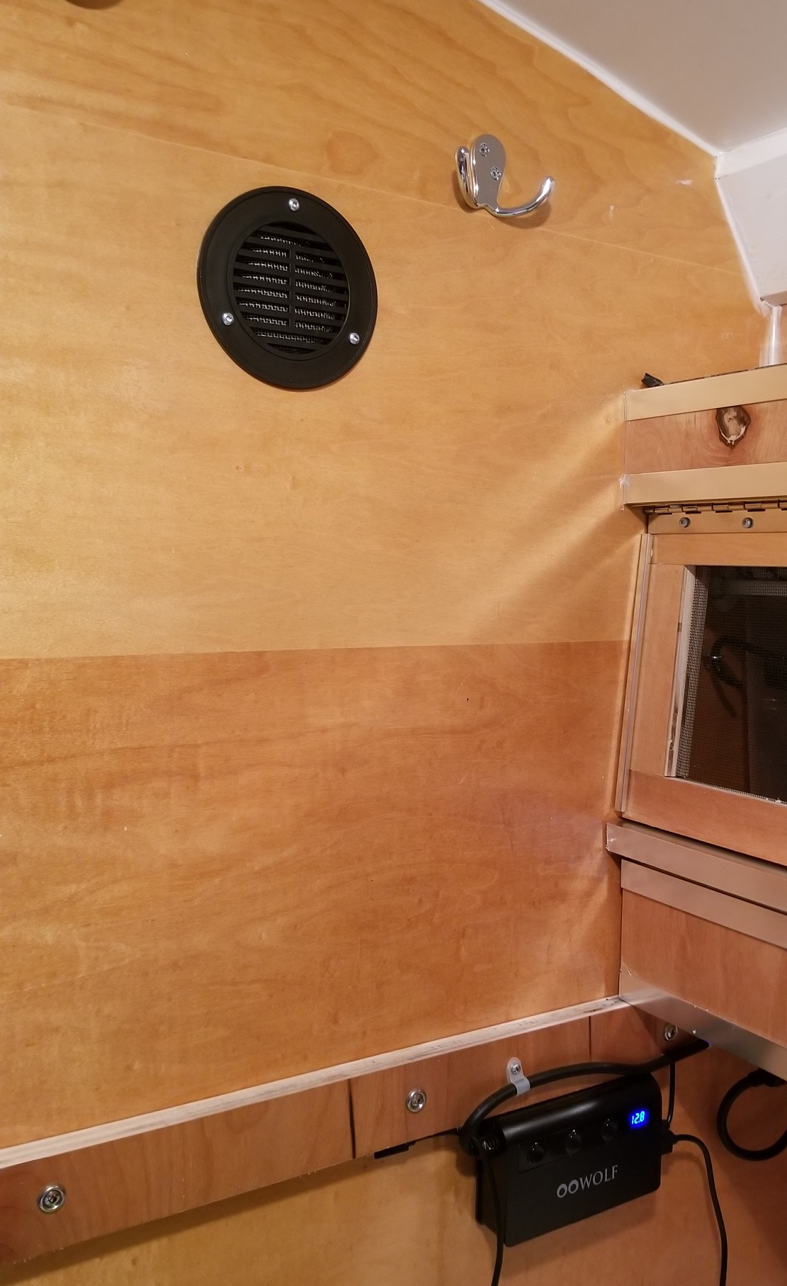 teardrop trailer interior with vent louvre installed high on wall