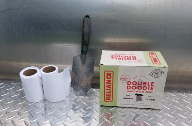 toilet paper,hand trowel, human waste bags