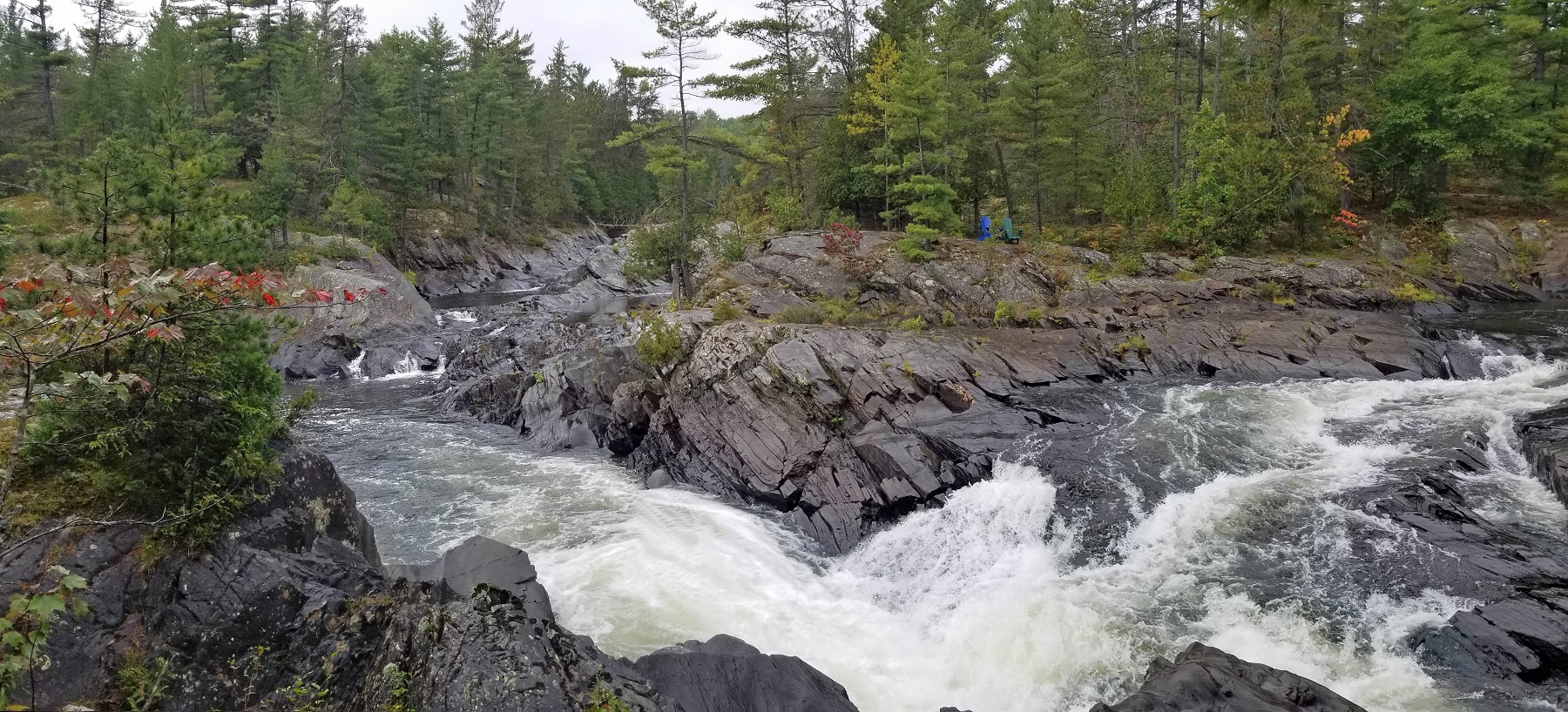 rugged Canadian Shield rock bounded by river rapids