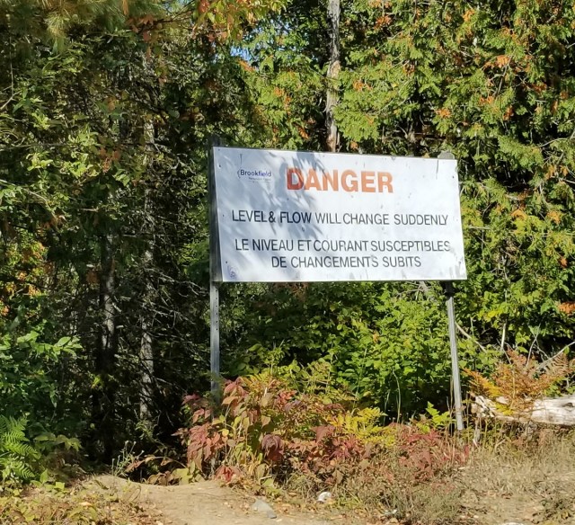 river flow warning sign