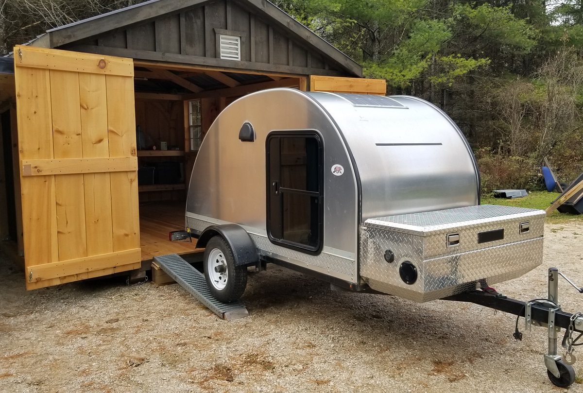 teardrop trailer beginning up ramp to enter shed