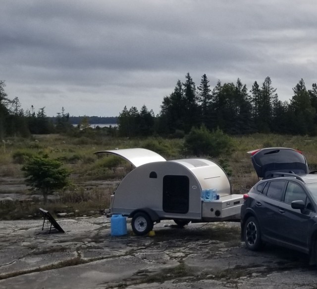 teardrop trailer with solar panel facing sun